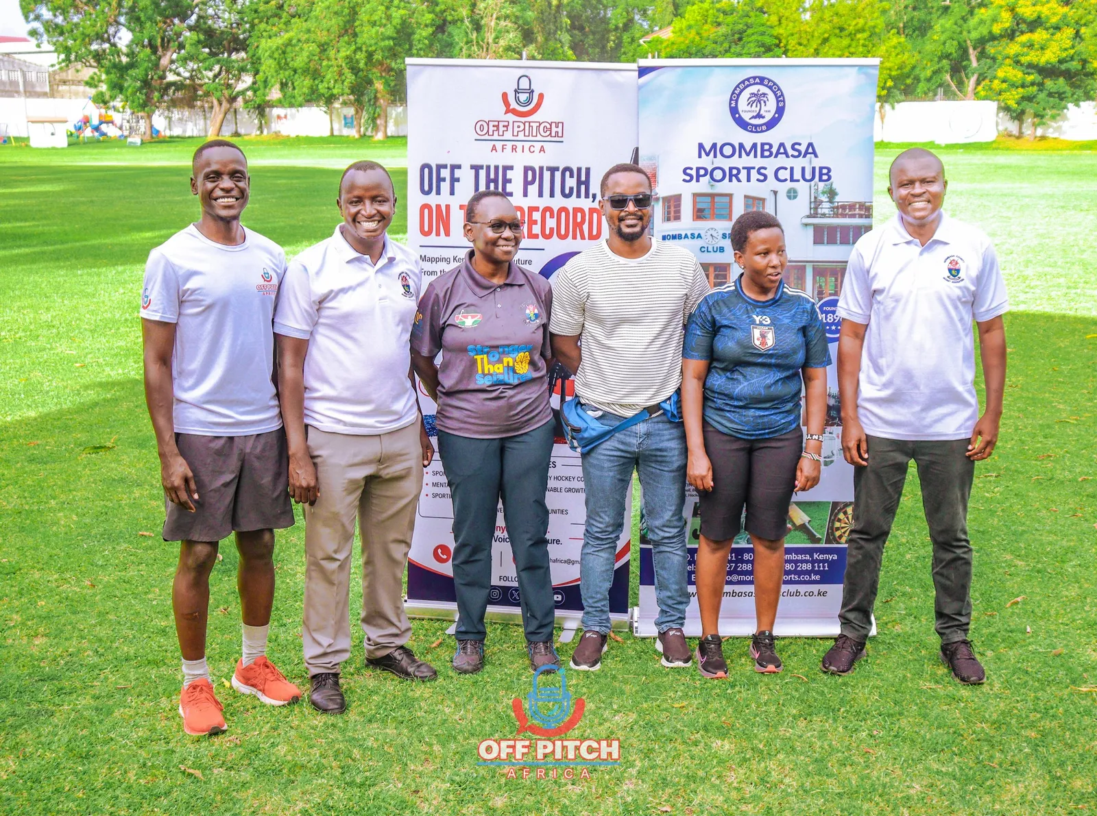 Group photo of Off Pitch Africa, Mombasa County Hockey Association and guests on the lawn at Mombasa Sports Club
